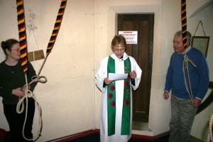 Rev Coralie McCluskey blessing the bells and ringers