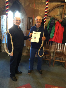 ART Teacher John Proudfoot presenting a 'Learning the Ropes' certificate for bell handling to Mike Rodger, ringer at Carlisle Cathedral